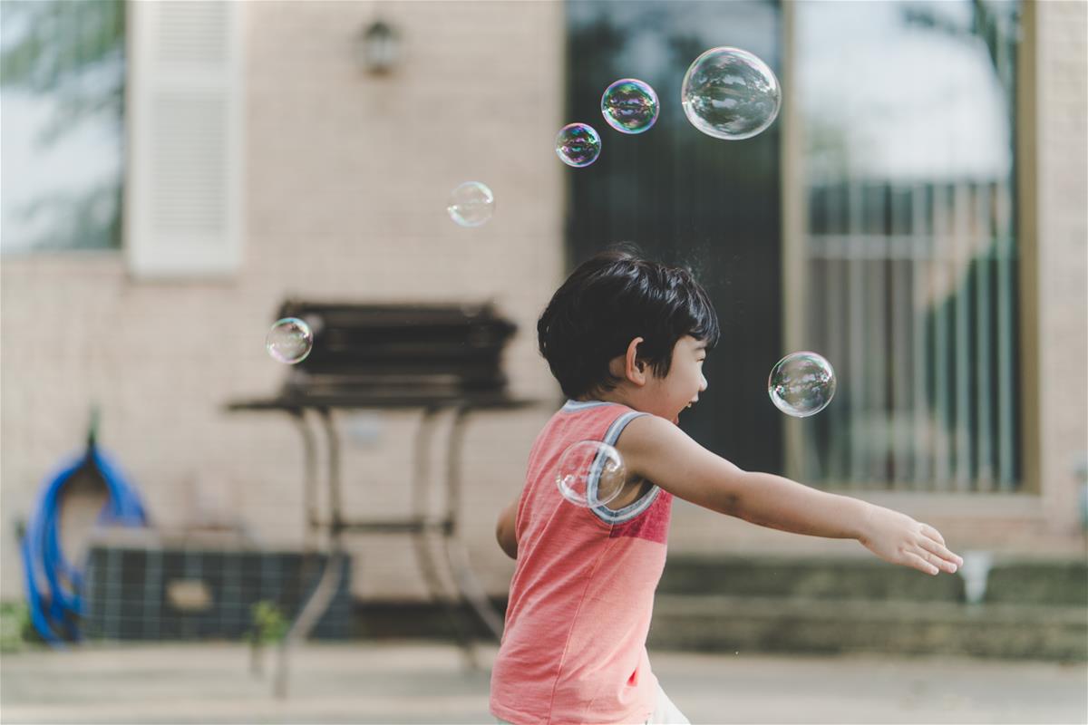 ChildPlayingWithBubbles
