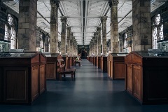person alone in a big library