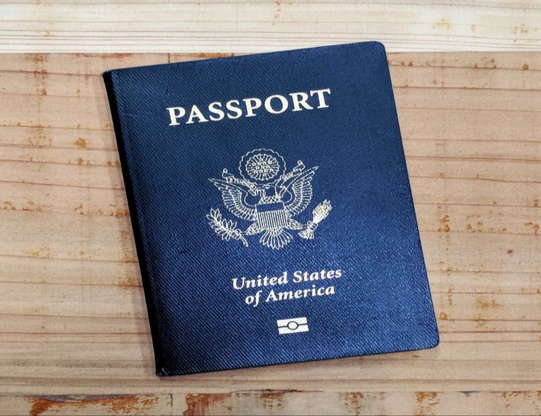 image of passport on wood