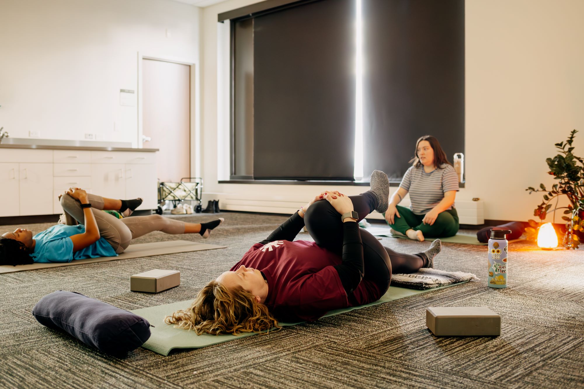 two people doing yoga