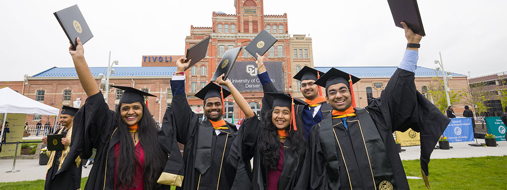CU Denver graduate students celebrating commencement