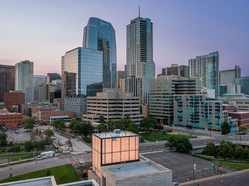 CU Denver campus buildings nestled between skyscrapers in downtown Denver