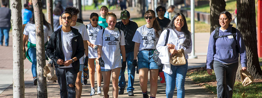 Group of CU Denver graduate students walking on campus