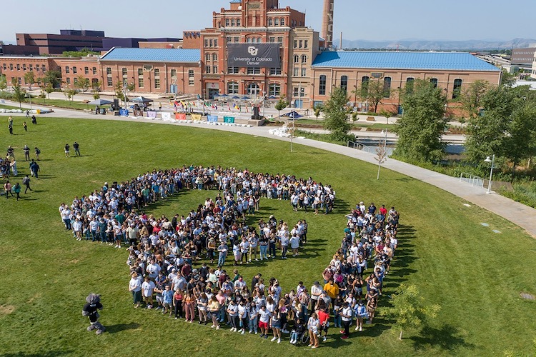 Aerial view of CU Denver students on the lawn making a giant human CU