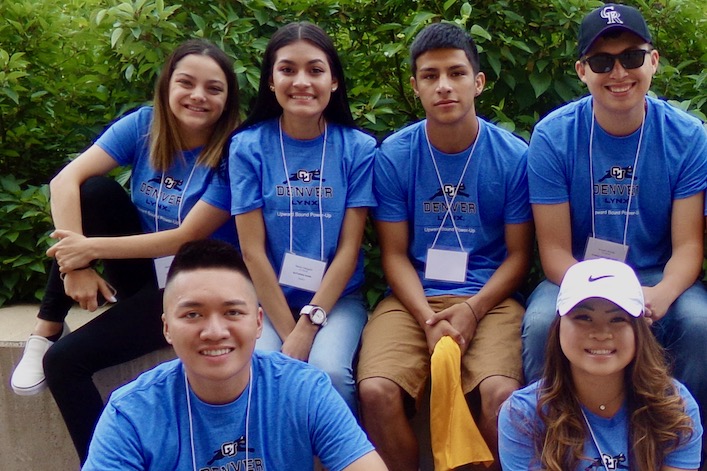 A group of CU Denver pre-college students wearing matching blue shirts