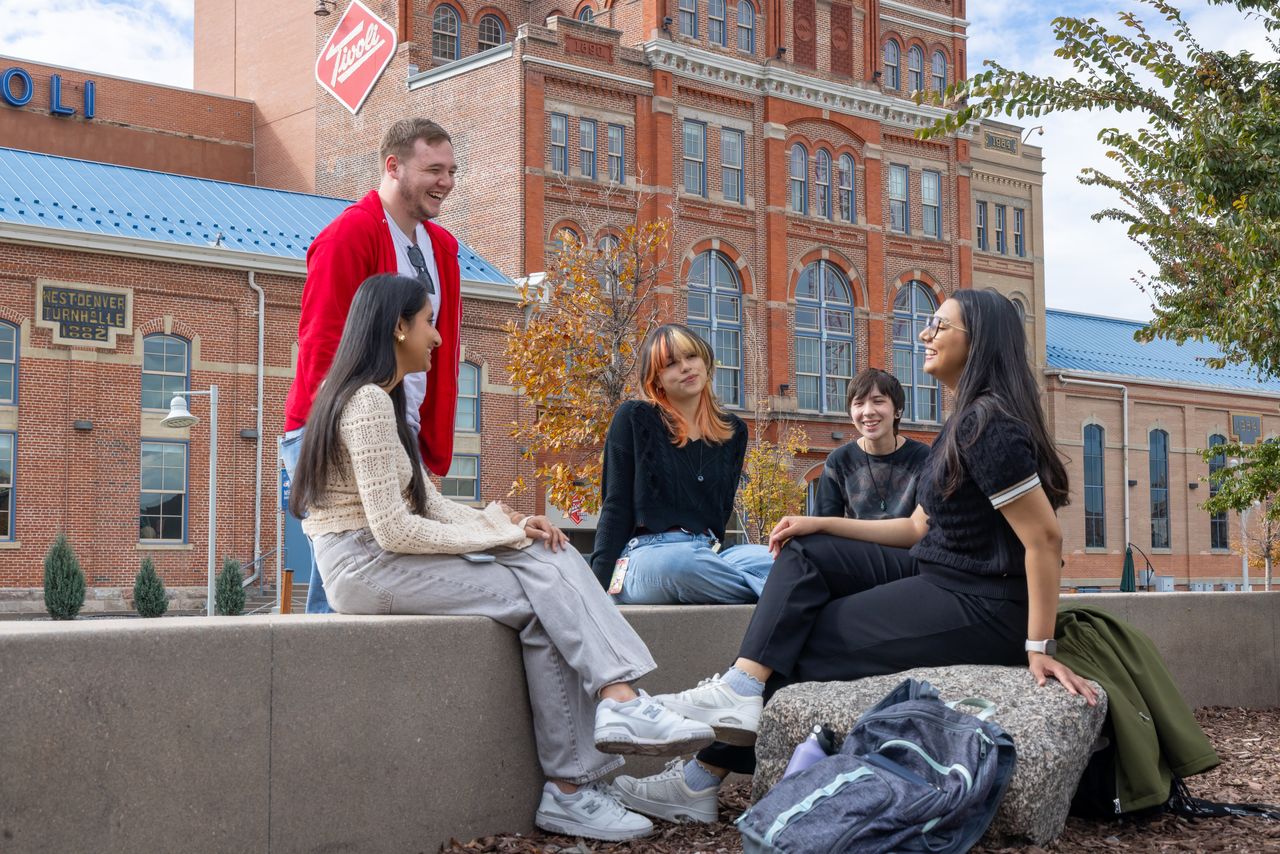 Five students enjoying the sunny Denver weather