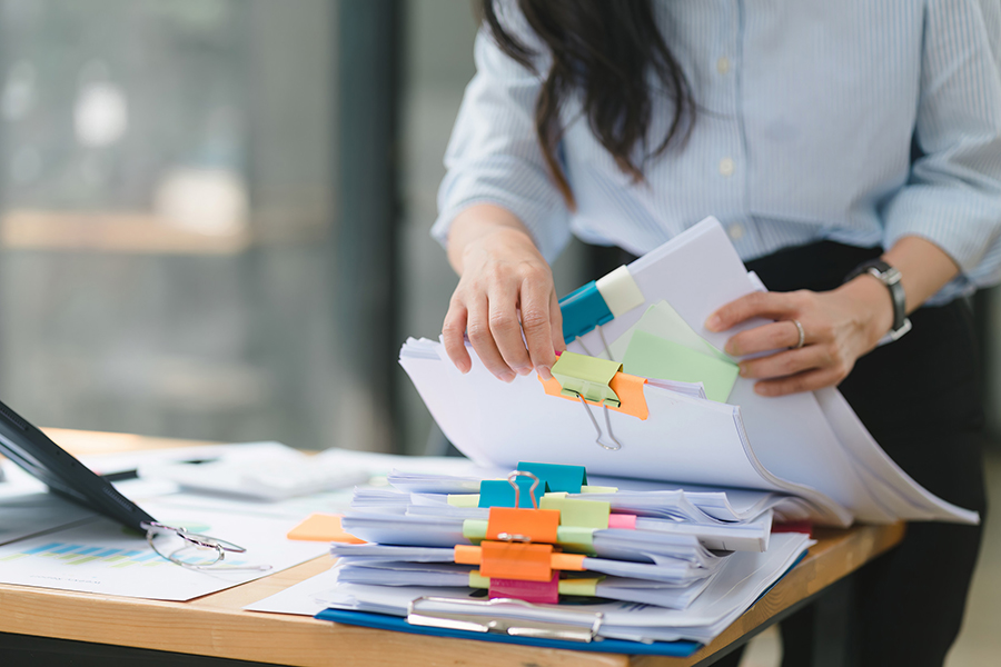 Female office worker with documents