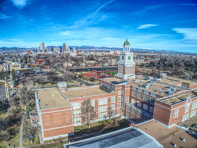 Aerial view of Denver and one of the public schools in the foreground.