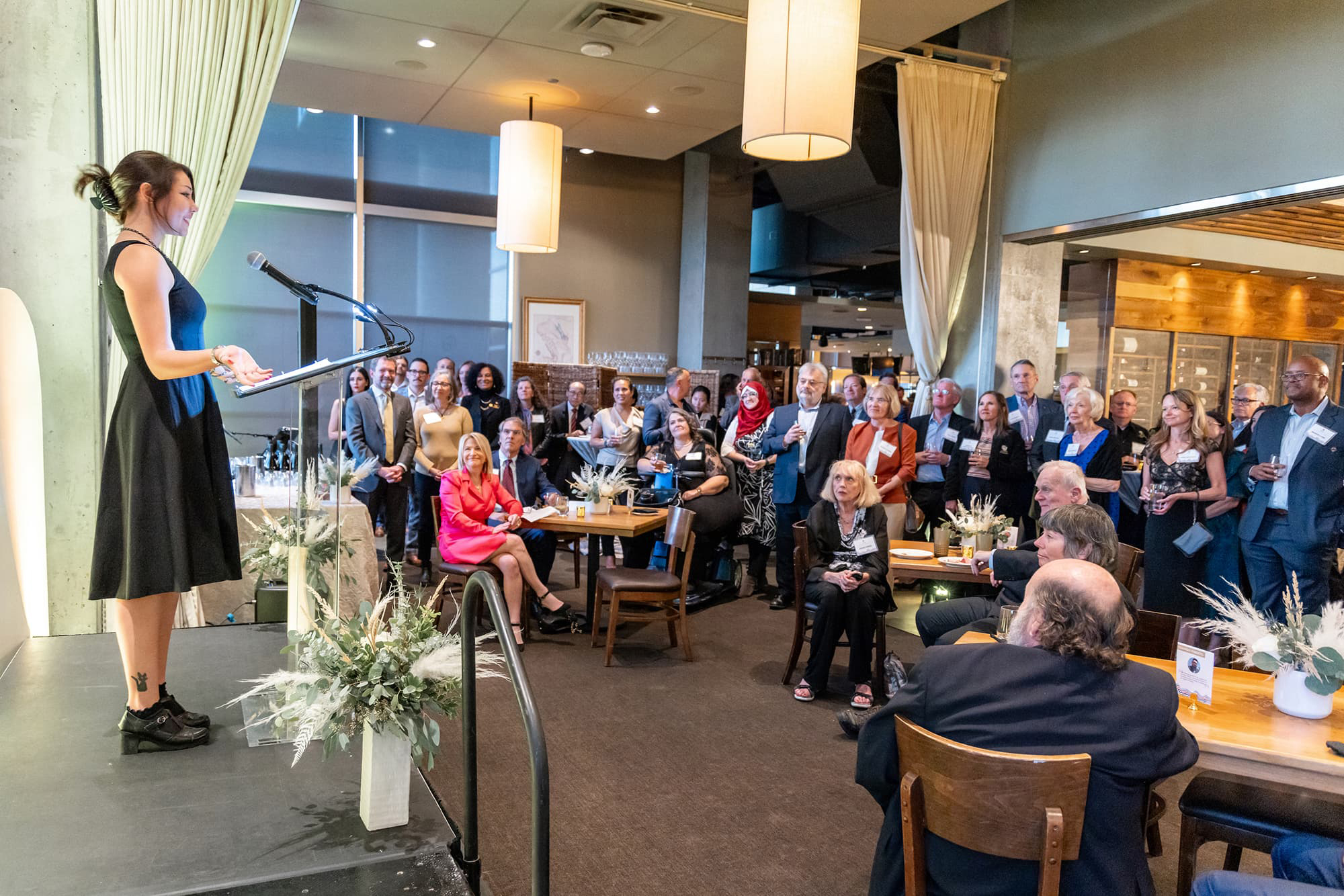 Audrey Whitesell speaking to a crowd of CU Denver supporters during the 2023 Donor Celebration event at Coohills.