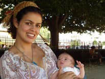 Badia Wechky holding a baby
