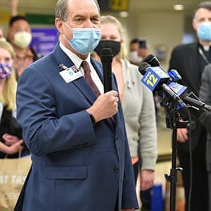 Kevin Slavin Speaking in Microphone to Colorado Nurses