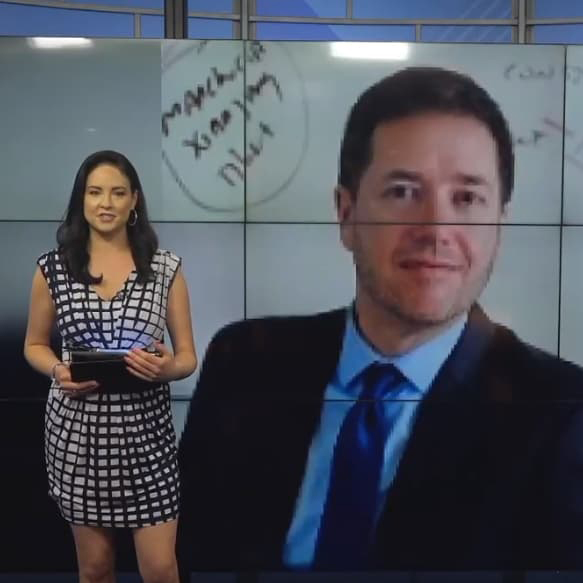 Screenshot of Facebook video with Samantha Mesa in front of a screen with Stephen Hartnett's headshot.