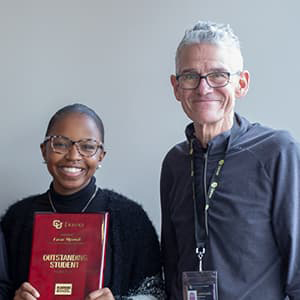 Fall 2021 Outstanding student with Dean Dawson