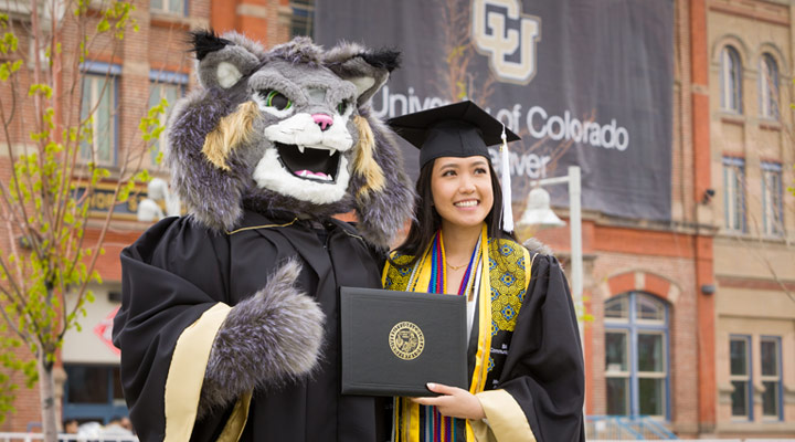 CU Denver graduate posing with Milo