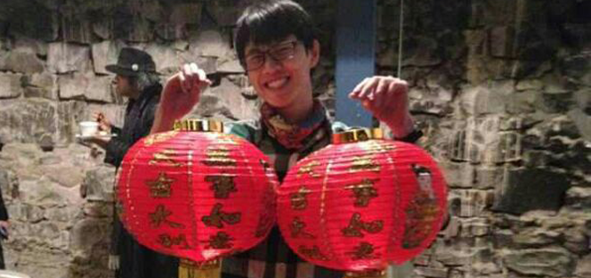 student holding lanterns