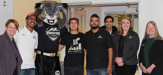 ESL Academy students posing with the UCD mascot