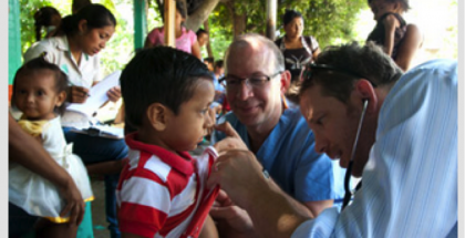 doctors examining children in Guatemala