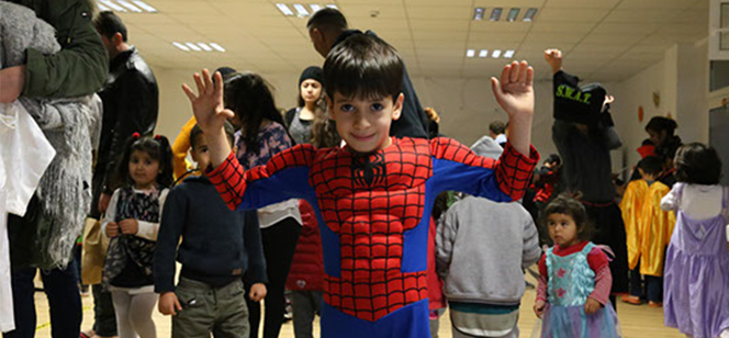 young boy in Spider Man costume