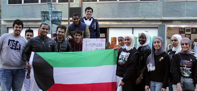 students holding the Kuwait flag