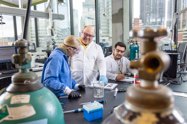 Faculty working with student in lab