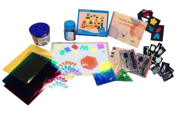 an array of items including a light box and various translucent shapes and sheets