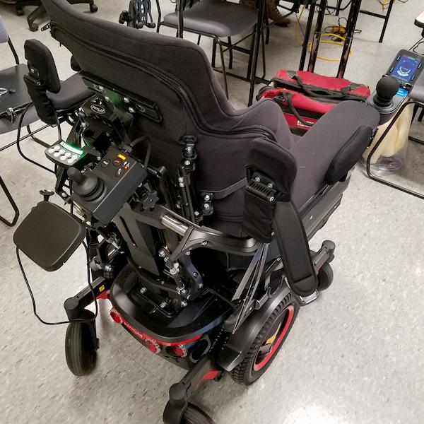 A power wheelchair with a specialized seating cushion