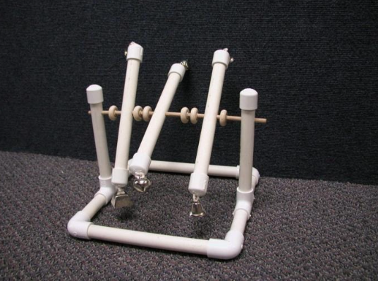 standing pvc tubes that hold additional, swinging tubes with bells on the ends