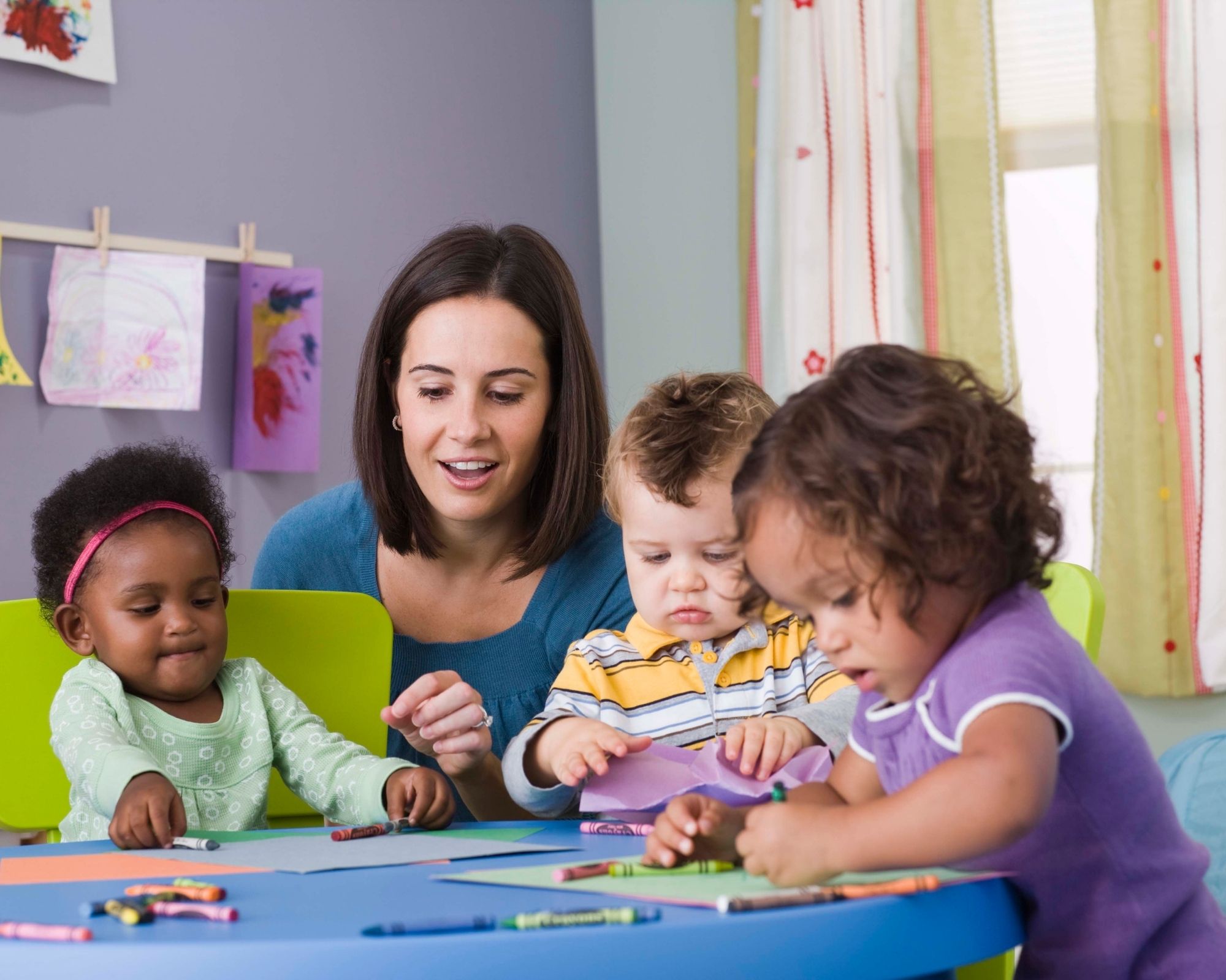 Teacher with group of small children