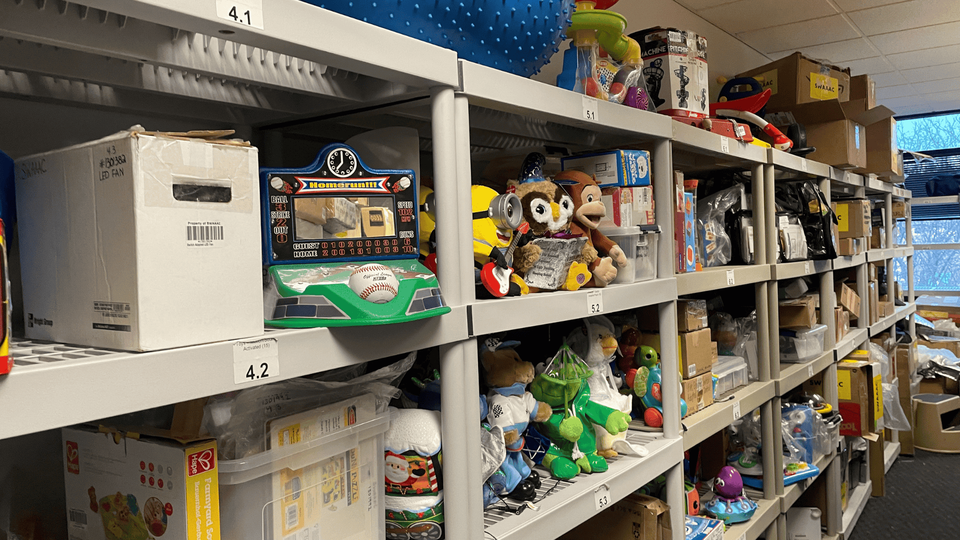 Rows of shelves with assistive technology for children
