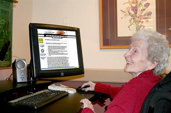 A senior works on a computer