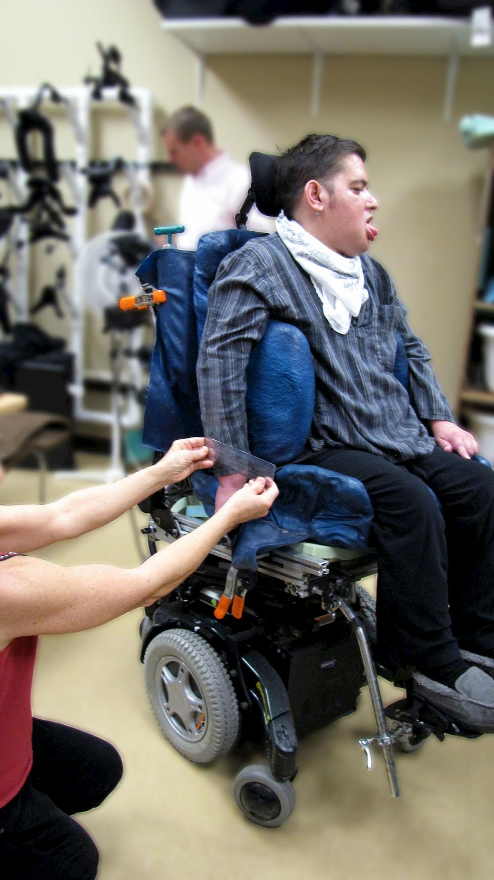 a therapist measure a person's wheelchair seating angle