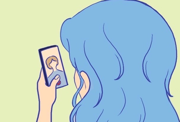 Colorful image of a CU Denver student with blue hair having a video call on a smartphone