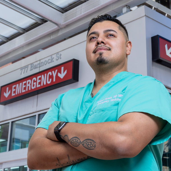 Will Mundo standing in front of Emergency Department