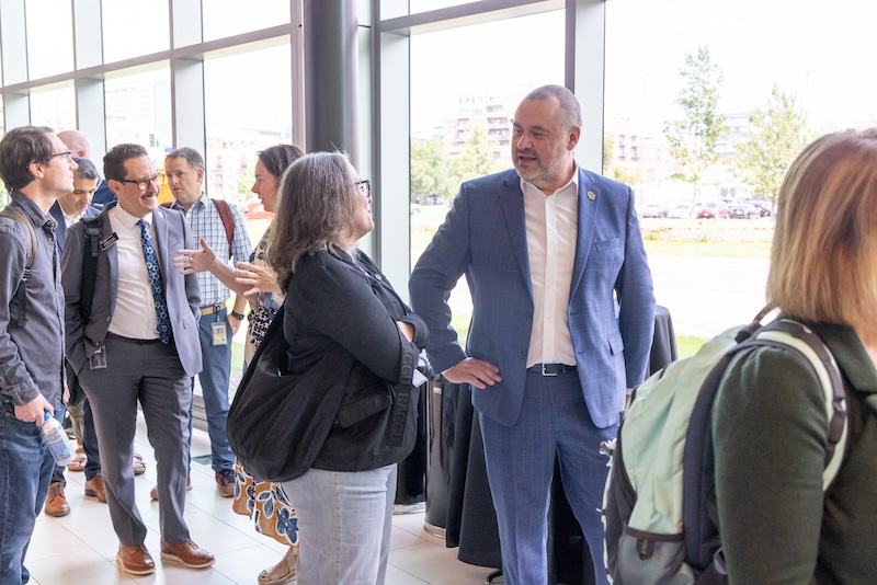 Chancellor Christensen chatting with campus member