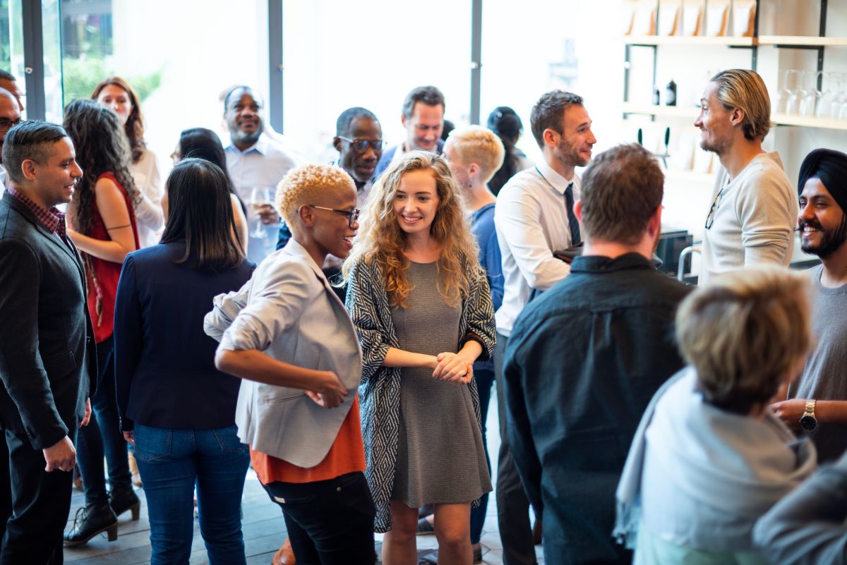 Group of people networking and smiling